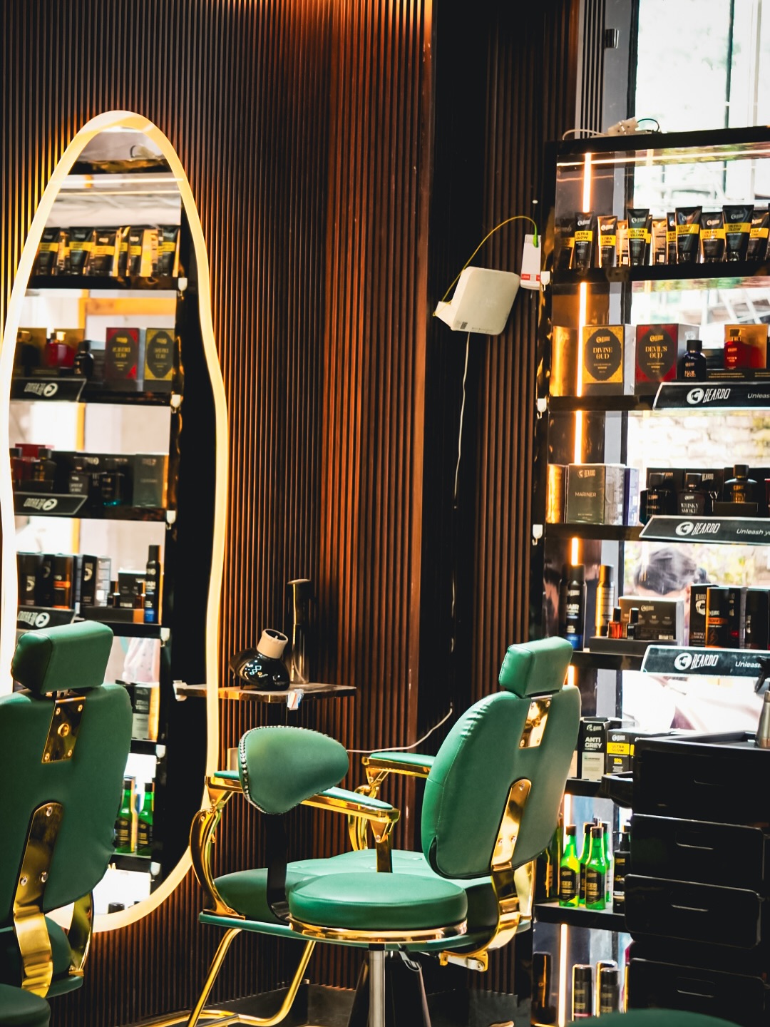 Luxurious hair salon interior with emerald green styling chairs at Music Salon Mandi